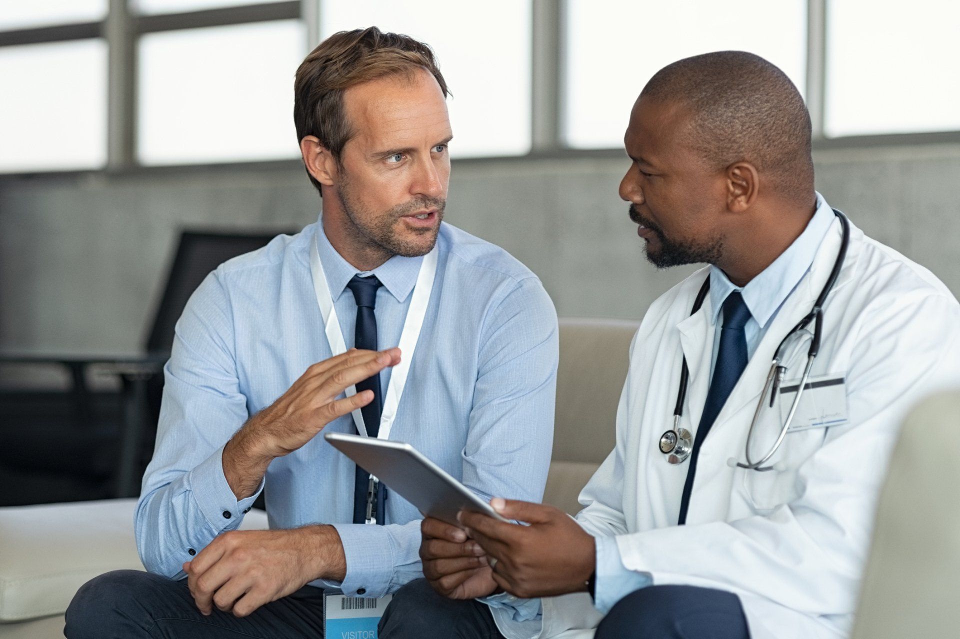 Two Doctors in a Medical Discussion — Santa Monica, CA — Active Therapy Center Two Doctors in a Medical Discussion — Santa Monica, CA — Active Therapy Center
